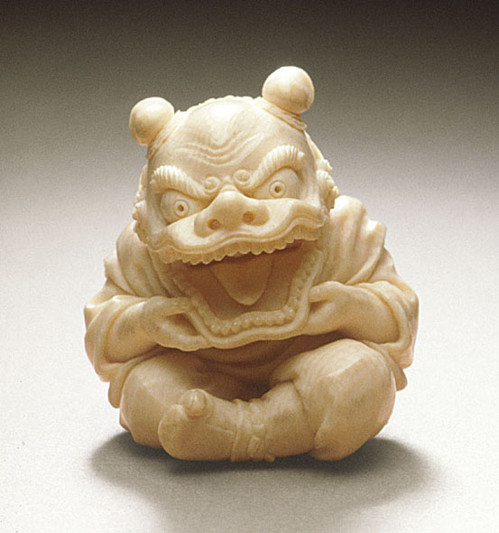 Figure 3 Kōmei netsuke. ‘Boy Behind Chinese Lion’s Mask’ Raymond Bushell Collection of the Los Angeles Museum of Art.